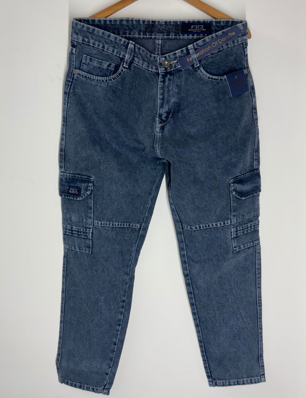 Blue jeans with cargo pockets on a white background
