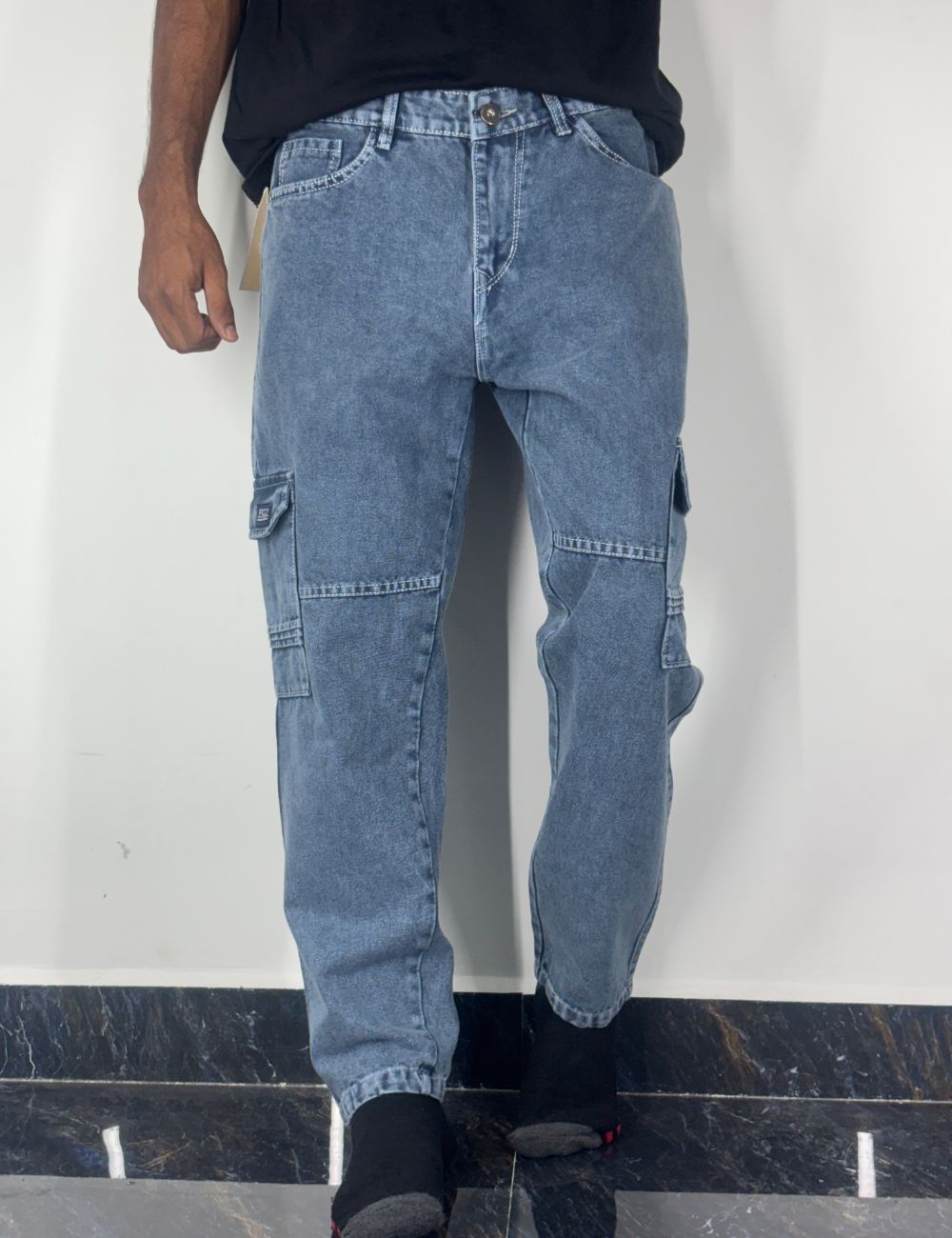 Blue jeans with cargo pockets on a white background